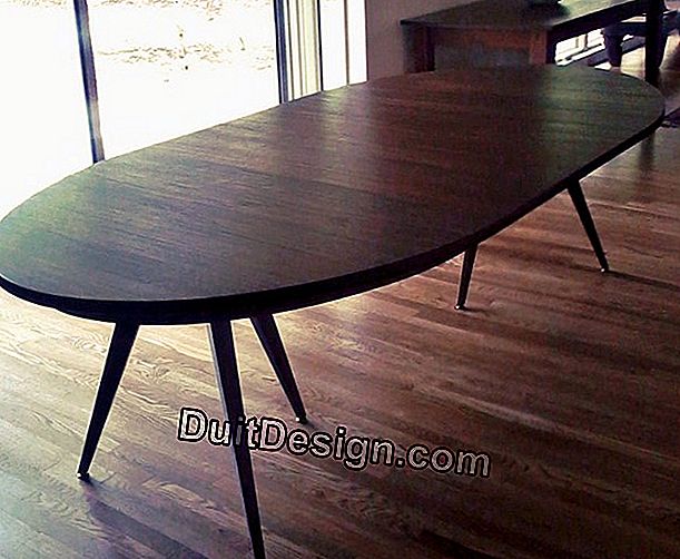 An oval table with extensions
